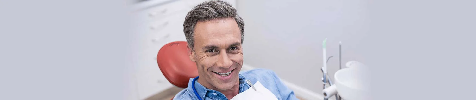 Smiling patient in the dental chair