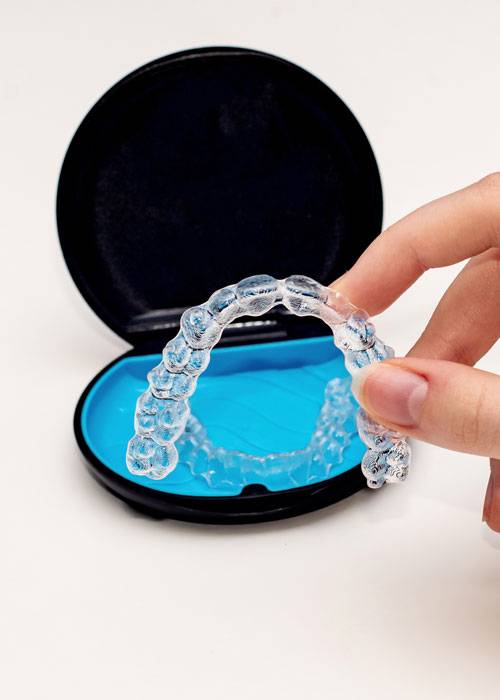 Invisalign aligners and storage case. Invisible braces. Clear te